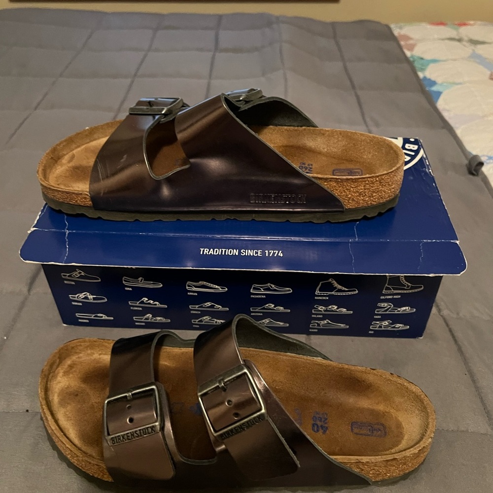 Birkenstock sandals. Metallic in color and size 9.